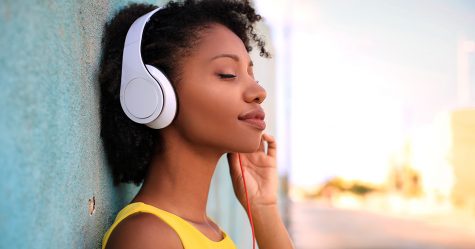 Portrait of a beautiful girl listening music